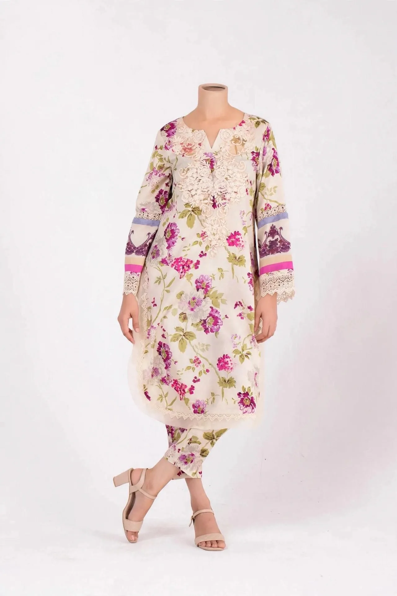 Women's cream floral printed lawn kurta and trouser set with white lace embroidery on neckline and sleeves - front view on mannequin