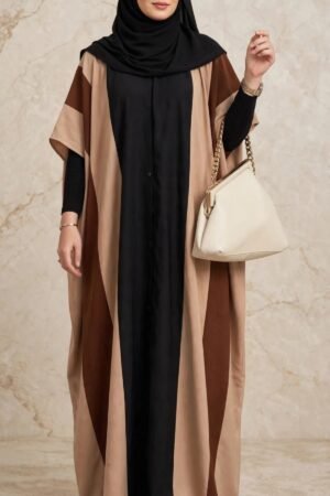 Front view of a woman wearing a Tri-Color Block Kaftan Abaya in black, beige, and caramel brown made of Saudi Nidah fabric.