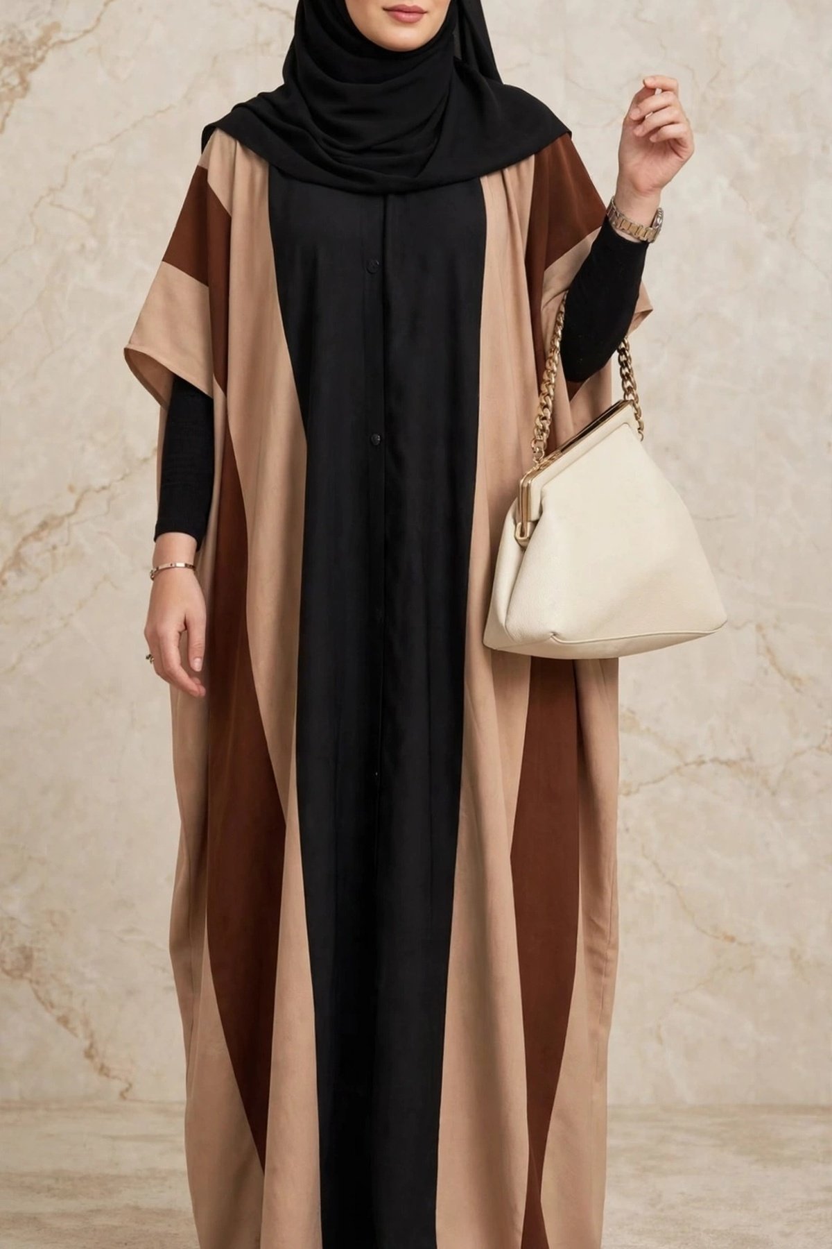 Front view of a woman wearing a Tri-Color Block Kaftan Abaya in black, beige, and caramel brown made of Saudi Nidah fabric.